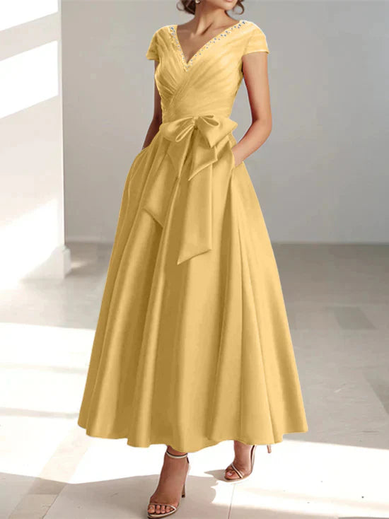 Abiti da mamma della sposa con tasche, scollo a V e stile principessa/a trapezio