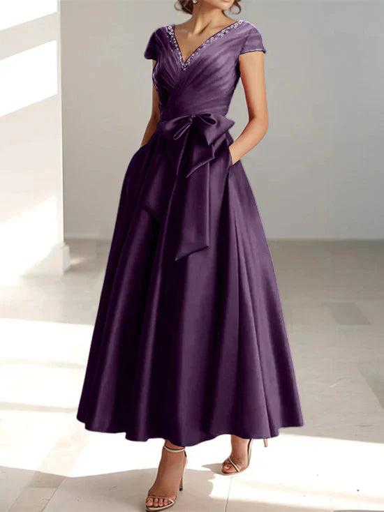 Abiti da mamma della sposa con tasche, scollo a V e stile principessa/a trapezio