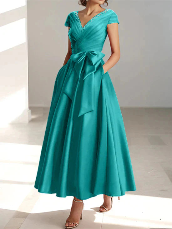 Abiti da mamma della sposa con tasche, scollo a V e stile principessa/a trapezio