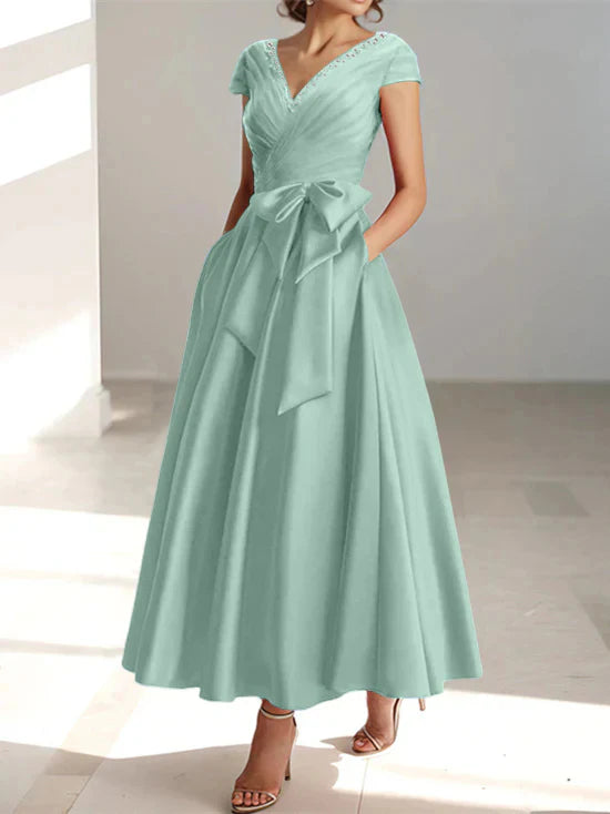 Abiti da mamma della sposa con tasche, scollo a V e stile principessa/a trapezio
