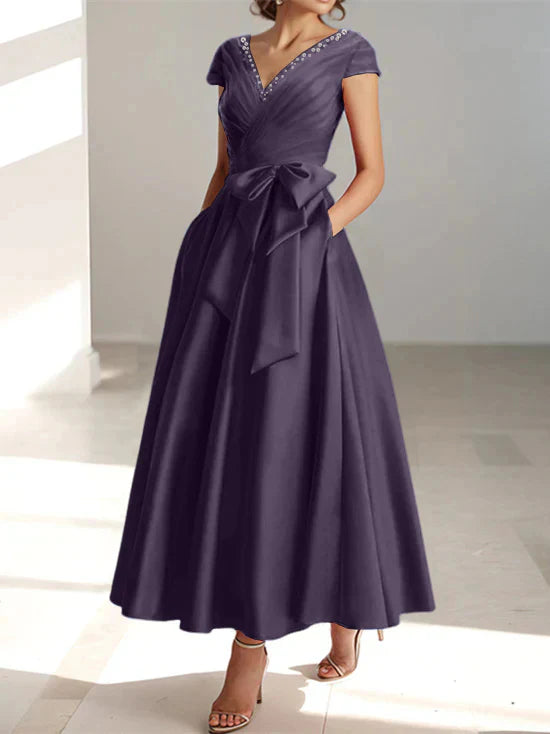 Abiti da mamma della sposa con tasche, scollo a V e stile principessa/a trapezio
