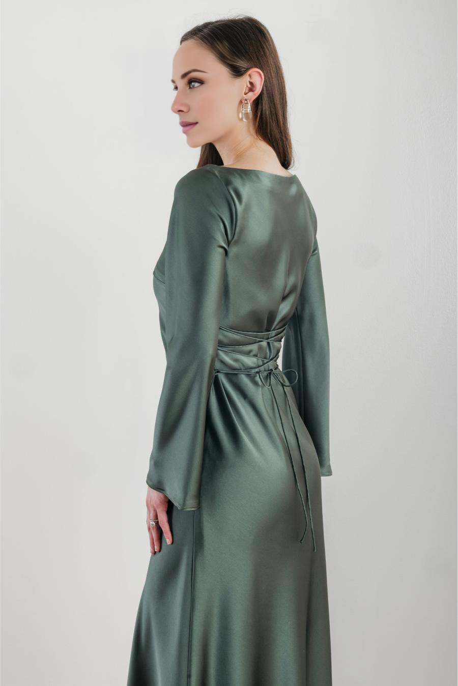 Jimiss boat neckline long sleeved satin and floor length evening dress
