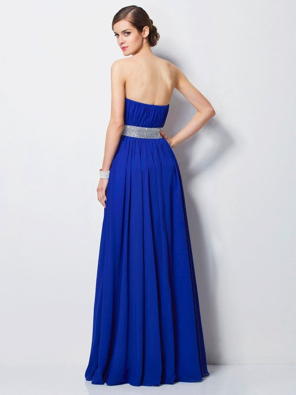 Vestidos largos de gasa con escote imperio, sin mangas y con cuentas