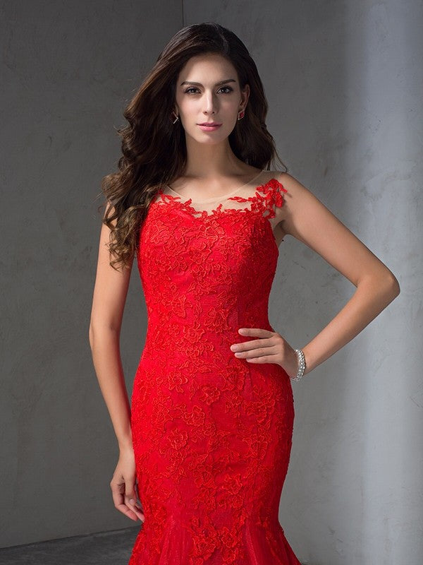 Vestidos largos de encaje sin mangas con apliques y escote redondo y corte tubo/columna