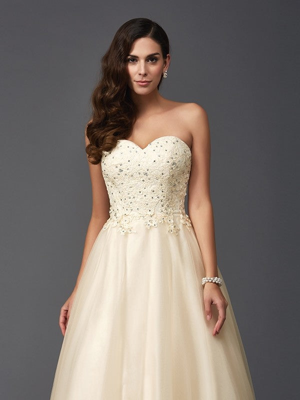 Vestidos largos de red sin mangas con escote corazón y cuentas de corte A/princesa