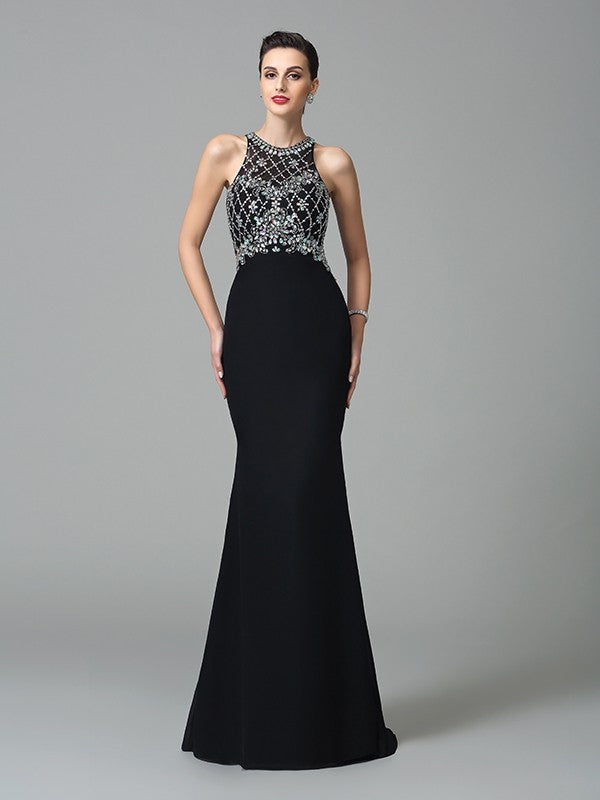 Vestidos largos de gasa sin mangas con pedrería y joya de corte trompeta/sirena