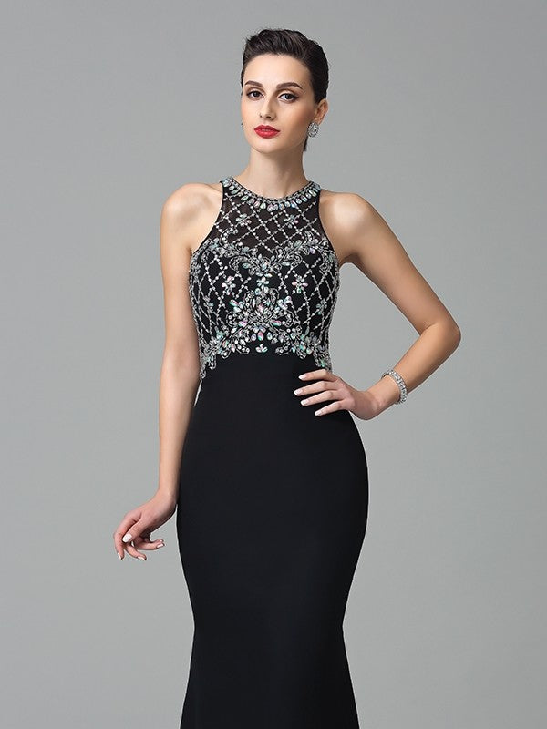 Vestidos largos de gasa sin mangas con pedrería y joya de corte trompeta/sirena