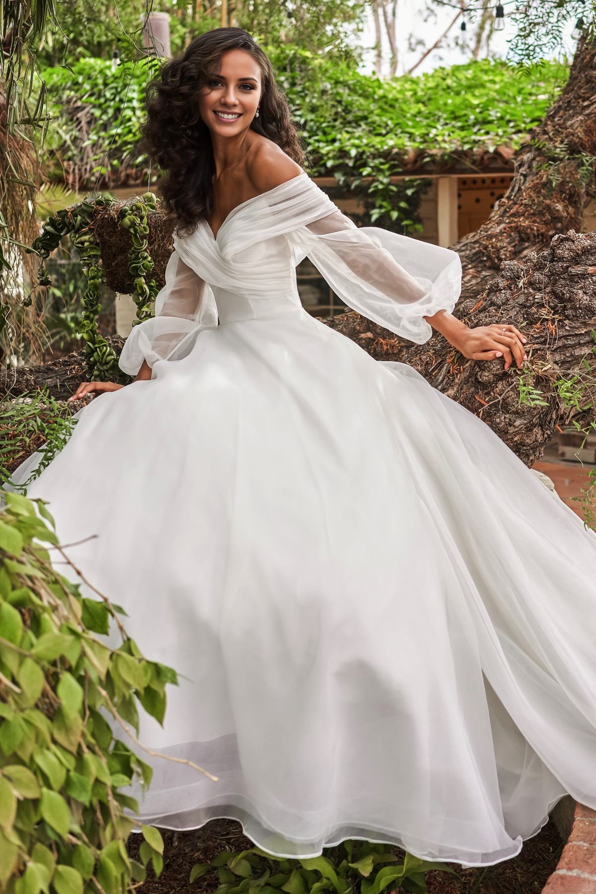 V-neckline slim fit waistline long sleeved and floor length wedding dress