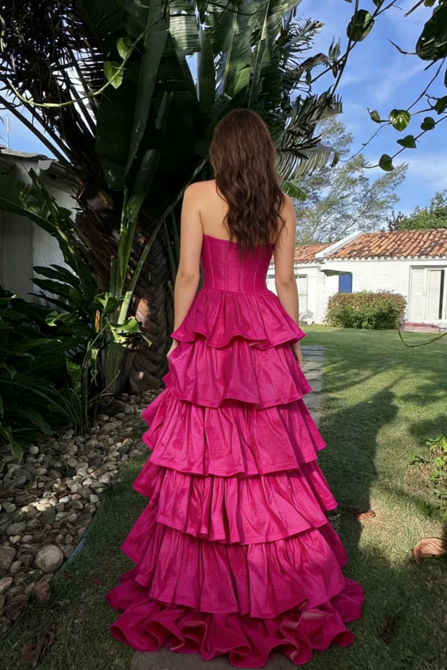 Bold Fuchsia Strapless Prom Dress with Corset Bodice and Tiered Ruffle Skirt