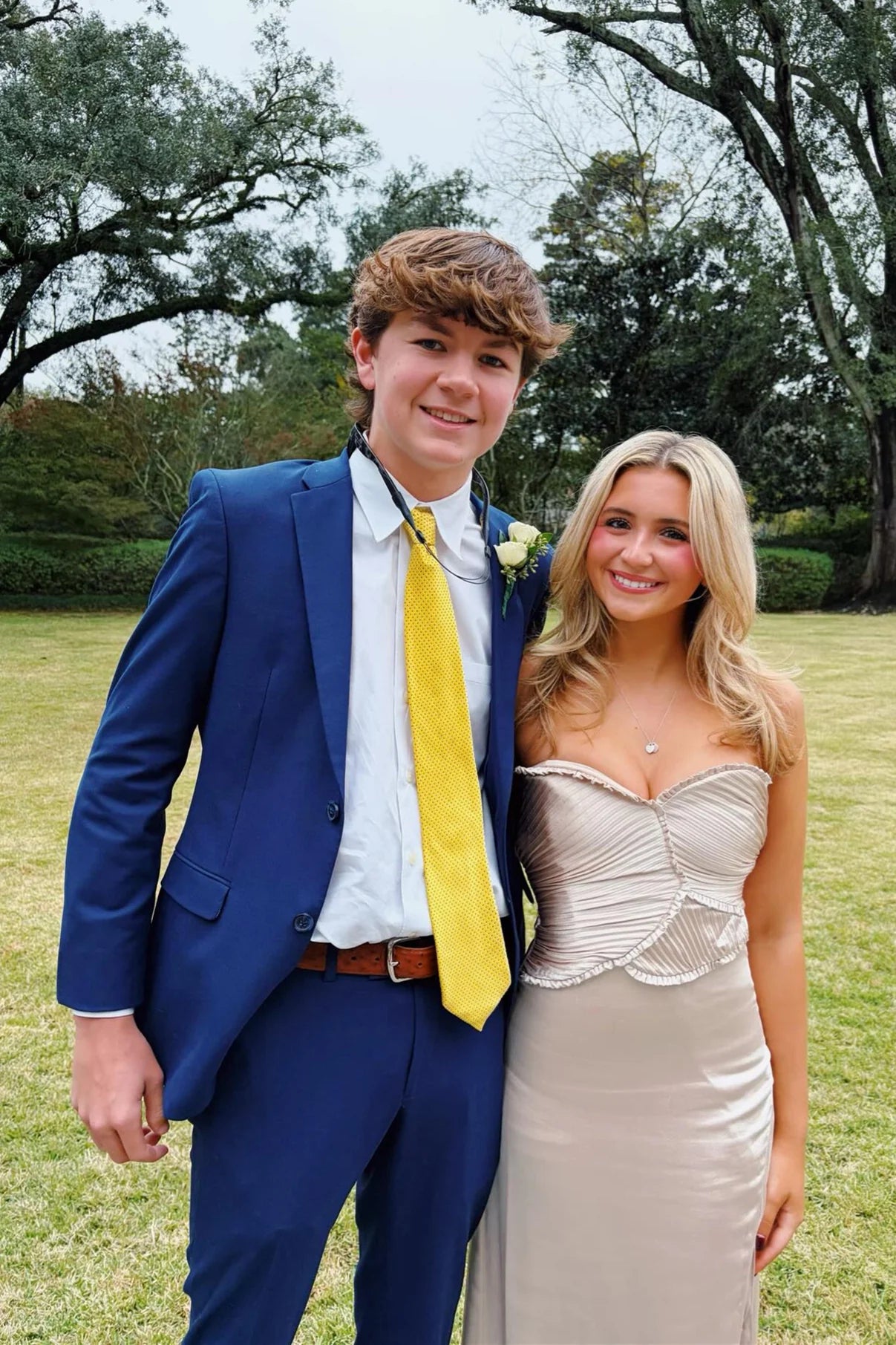 Elegant Strapless Prom Dresses with Ruched Bodice, Ruffle Trim, Side Slit and Flowing Satin Maxi Silhouette Formal Gown