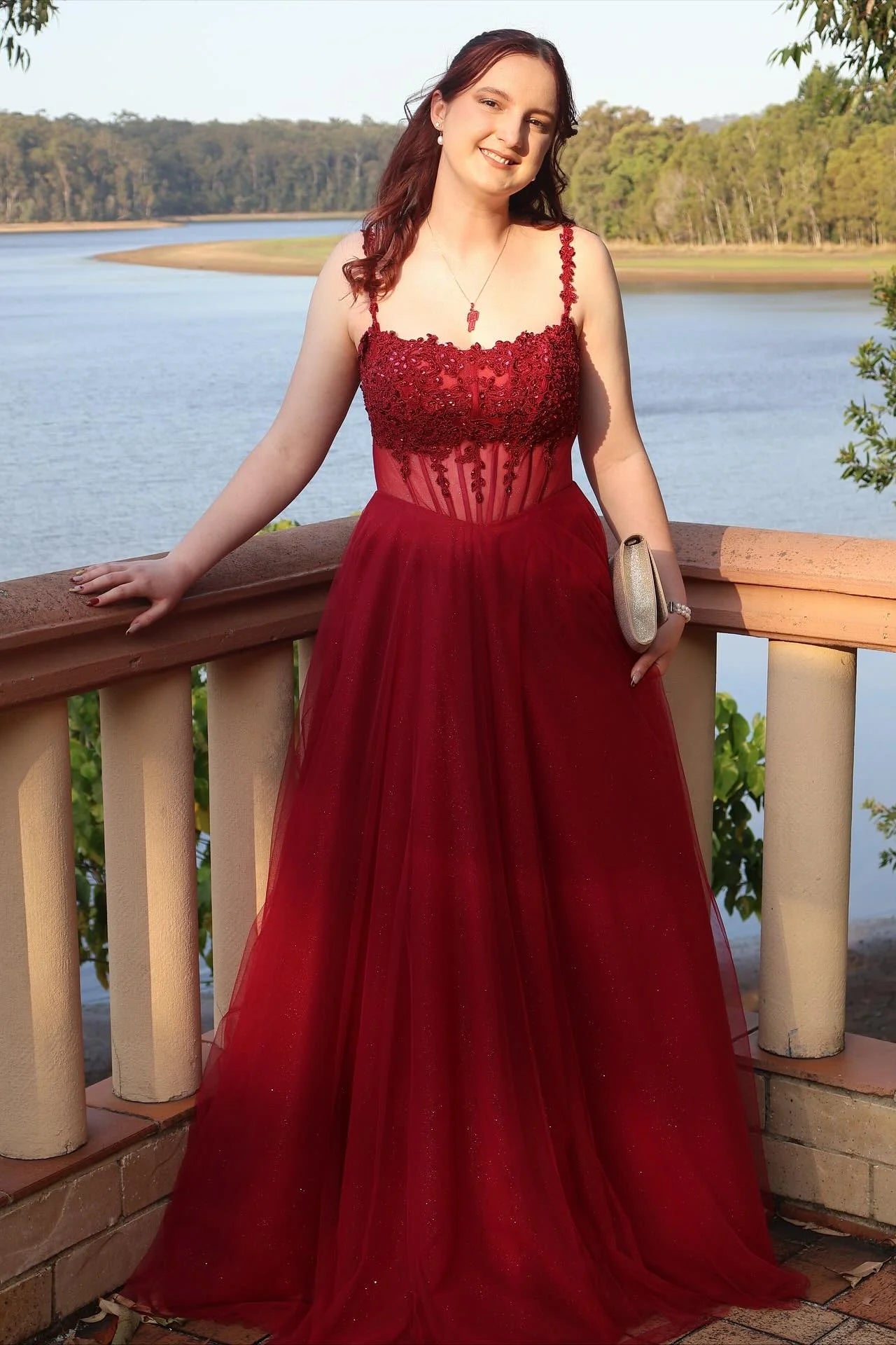 Enchanting lace corset prom dress with spaghetti straps, square neck, and tulle ball gown skirt