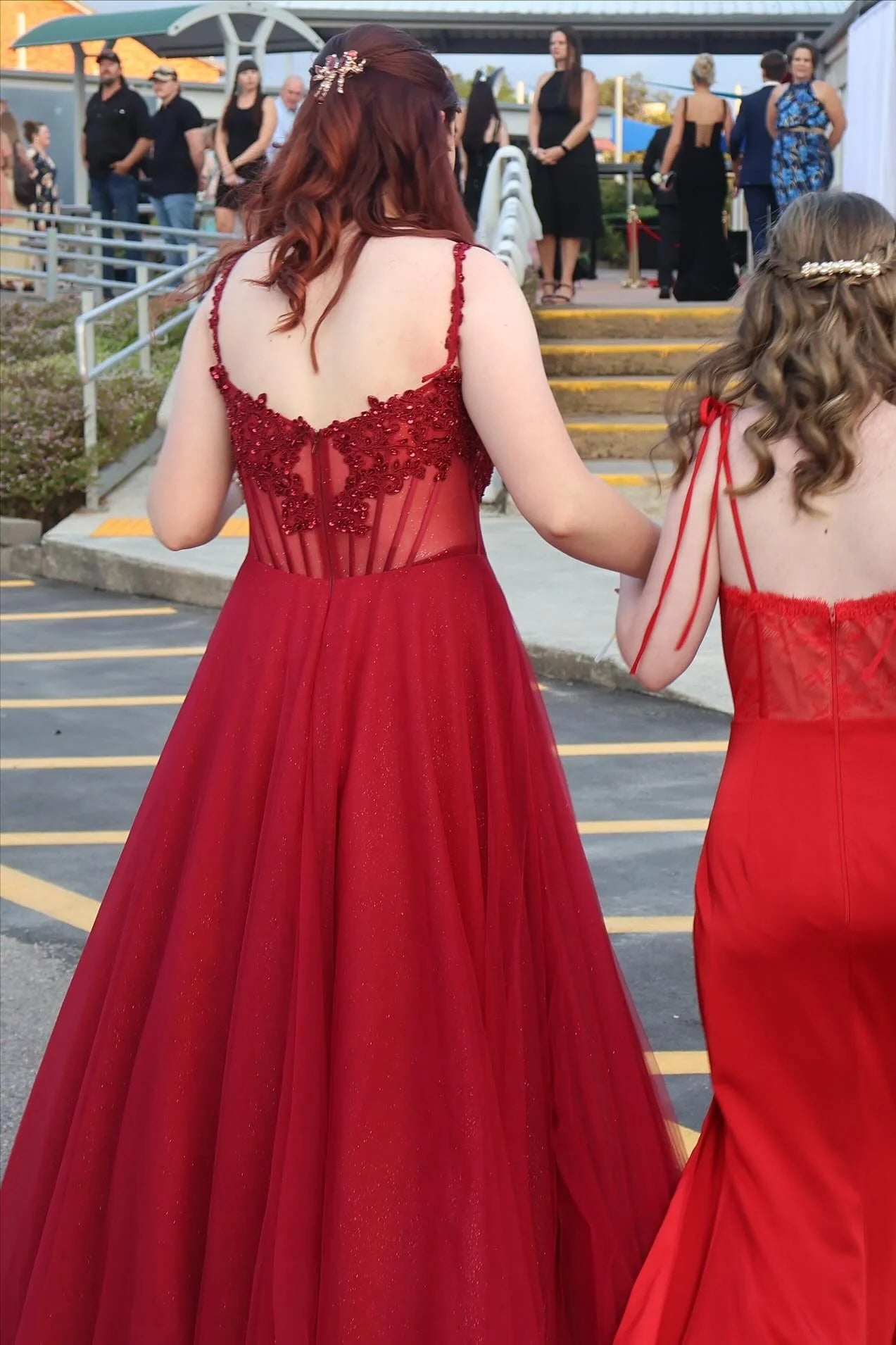 Enchanting lace corset prom dress with spaghetti straps, square neck, and tulle ball gown skirt