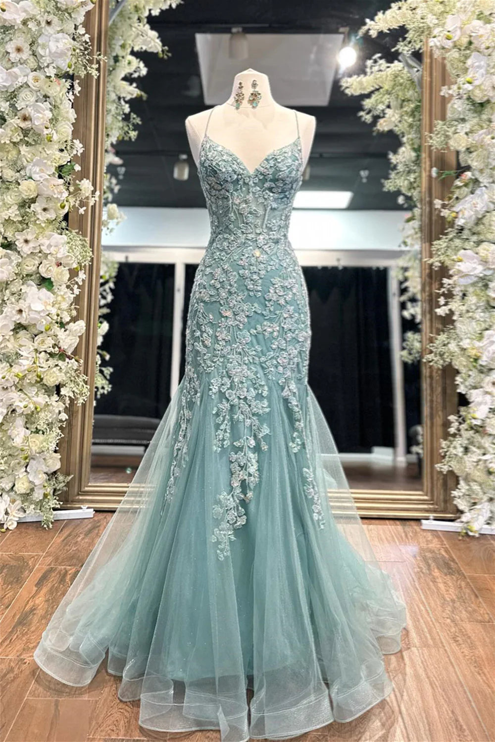 Enchanting spaghetti strap tulle prom gown with floral lace appliqué, lace-up back and mermaid train