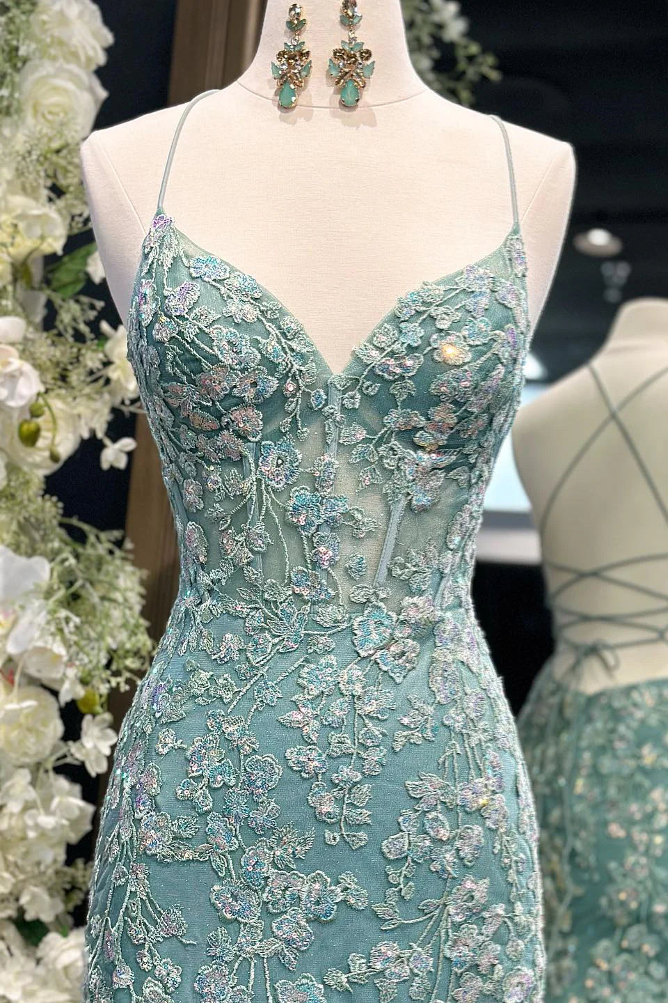 Enchanting spaghetti strap tulle prom gown with floral lace appliqué, lace-up back and mermaid train