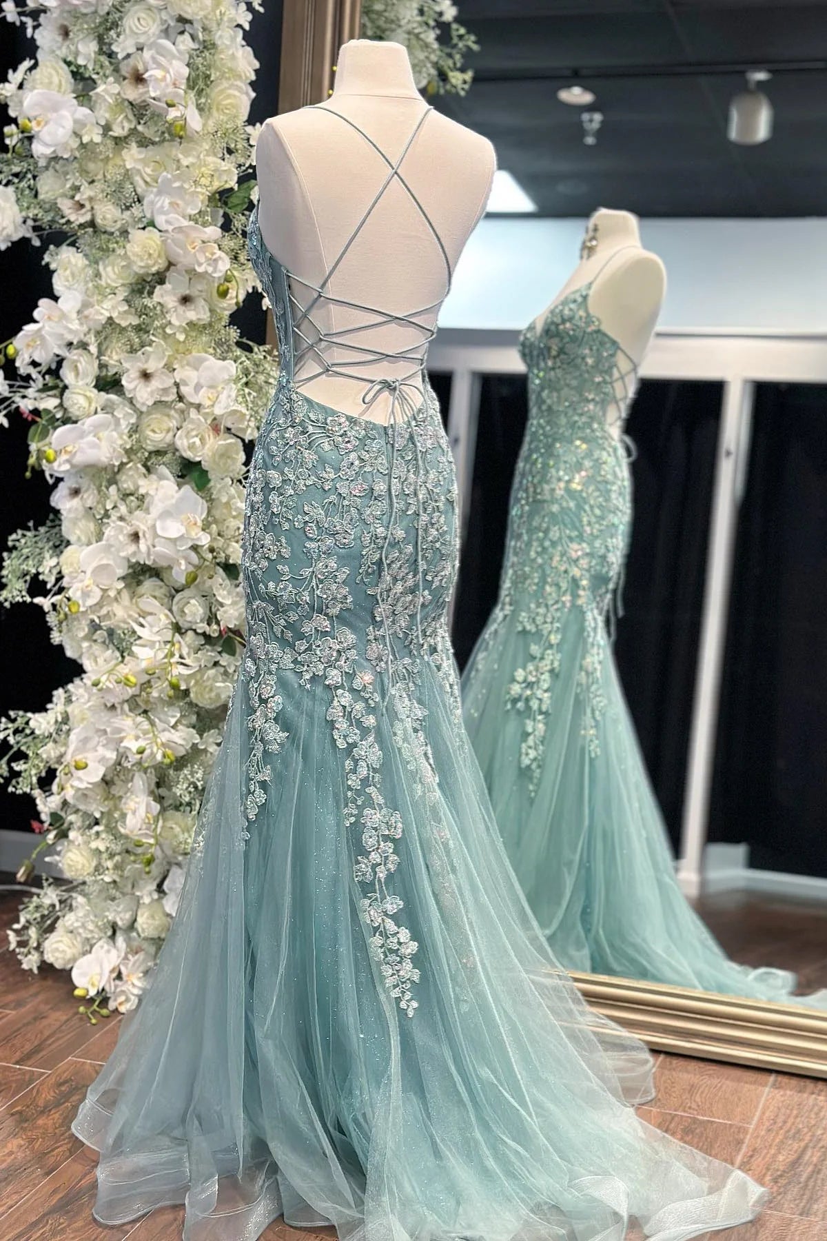 Enchanting spaghetti strap tulle prom gown with floral lace appliqué, lace-up back and mermaid train