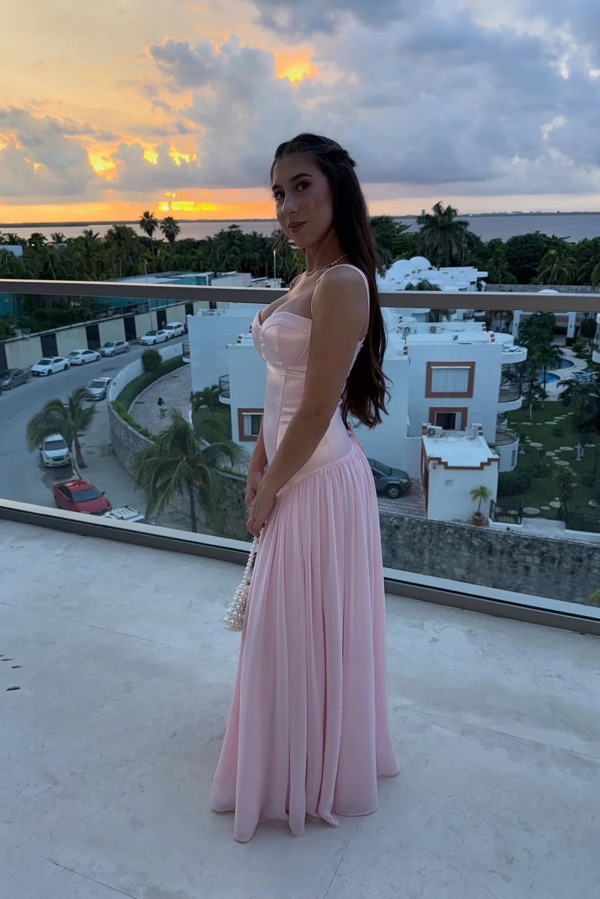 Feminine satin chiffon spaghetti strap sweetheart neck open back floor length prom dress with lace up back detail and flowy skirt