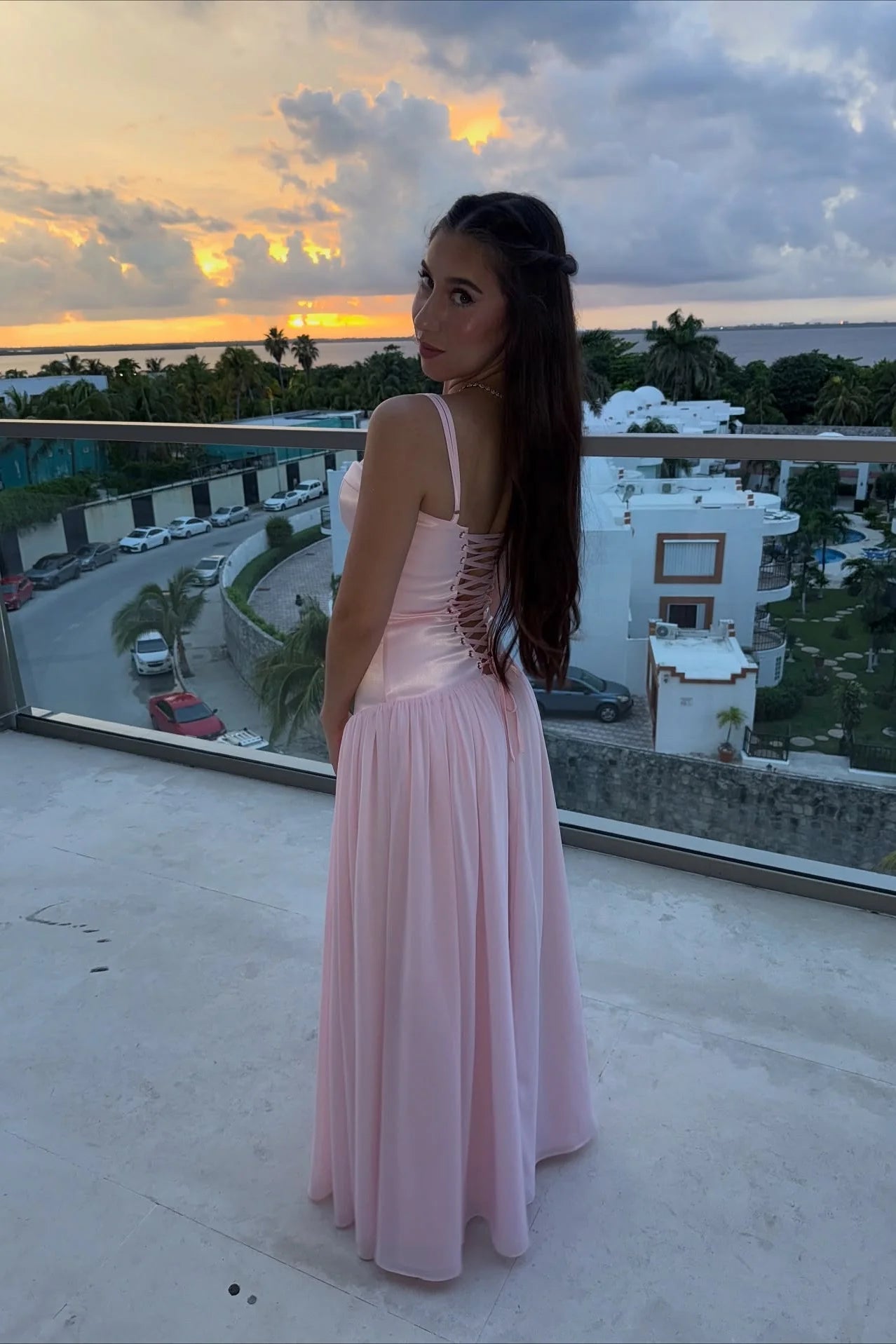 Feminine satin chiffon spaghetti strap sweetheart neck open back floor length prom dress with lace up back detail and flowy skirt