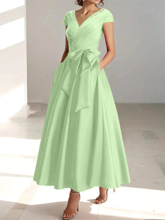 Abiti da mamma della sposa con tasche, scollo a V e stile principessa/a trapezio