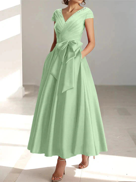 Abiti da mamma della sposa con tasche, scollo a V e stile principessa/a trapezio