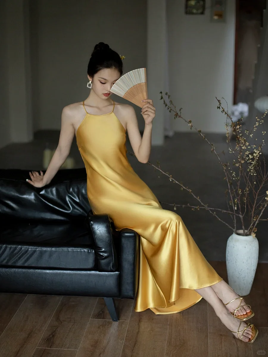Vibrant satin slip halter-neck sleeveless crisscross-back floor-length evening dress