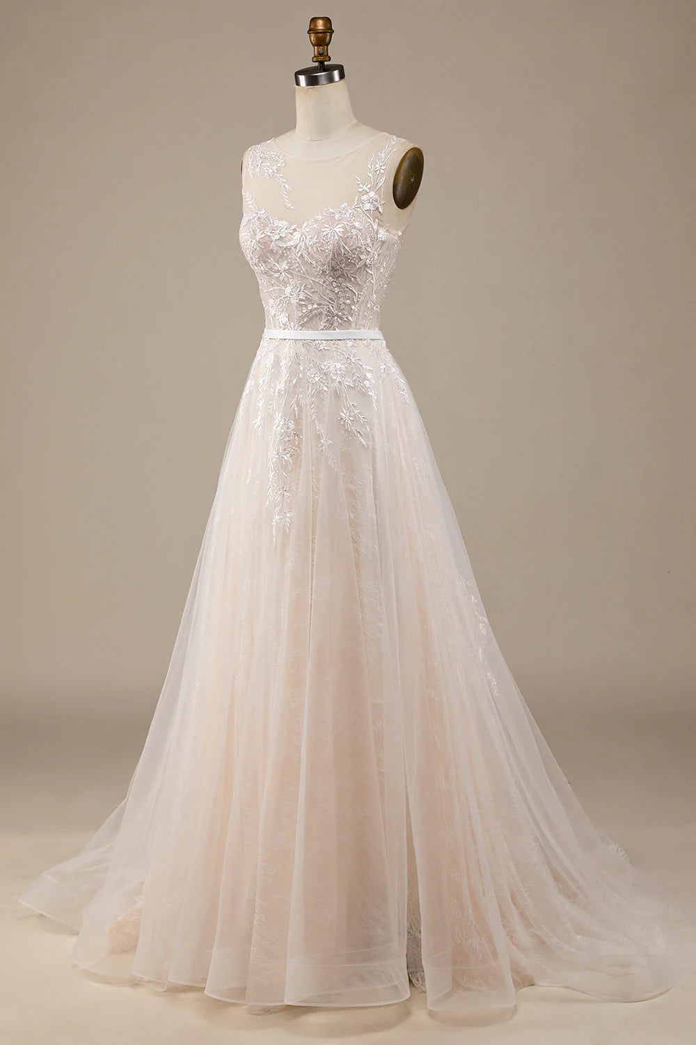 Vestido de novia de corte A con cola y encaje transparente color champán