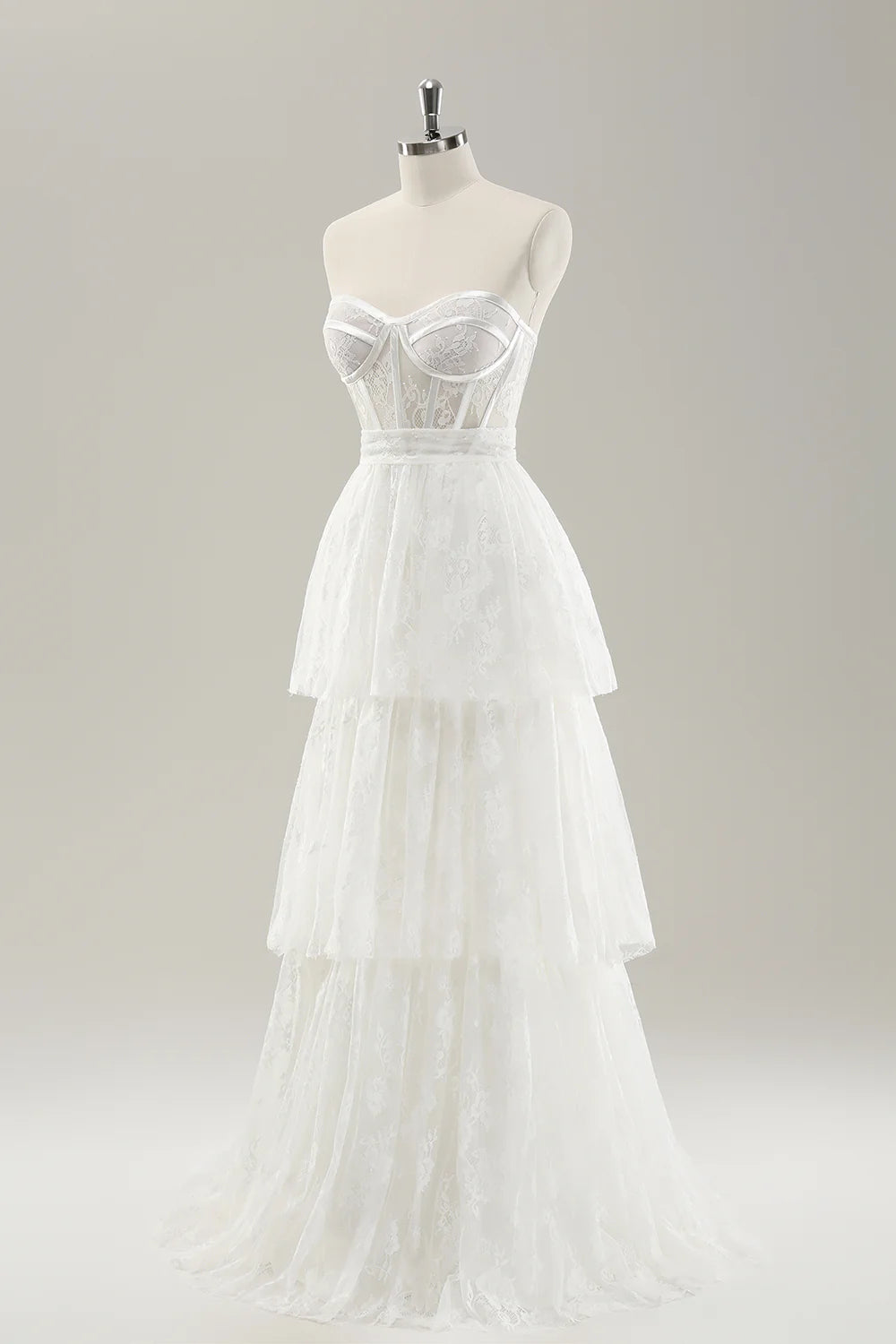 Abito da sposa lungo a strati con corsetto stretto senza spalline bianco