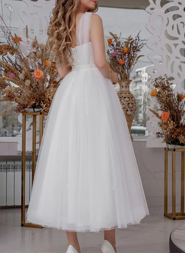 Abito da sposa a trapezio con scollo a V, senza maniche, paillettes e caviglie trasparenti