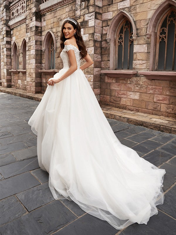 Abiti da sposa in tulle senza maniche, con strascico, a trapezio/principessa, con applicazioni e spalle scoperte