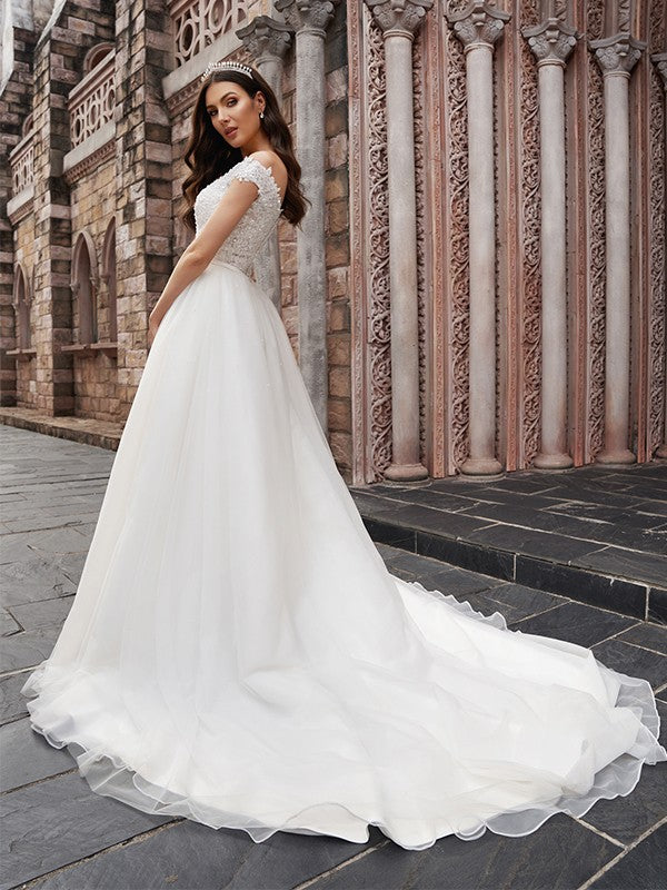 Abiti da sposa in tulle senza maniche, con strascico, a trapezio/principessa, con applicazioni e spalle scoperte