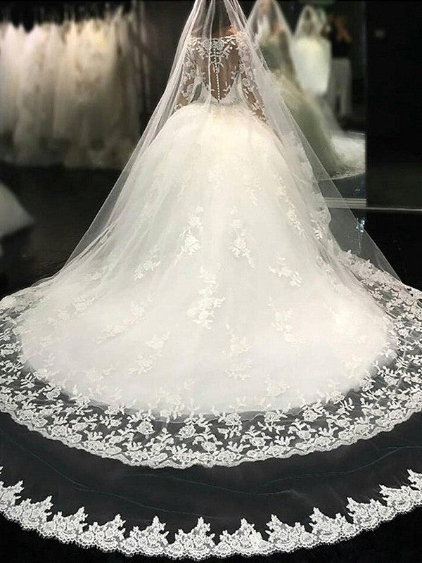 Vestidos de novia con escote redondo, mangas largas, encaje, cola catedral, apliques de tul