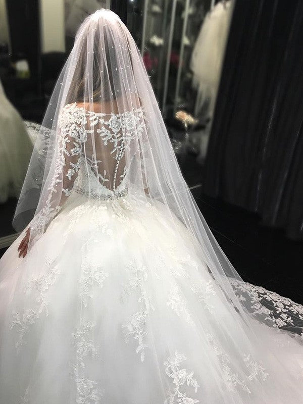 Vestidos de novia con escote redondo, mangas largas, encaje, cola catedral, apliques de tul