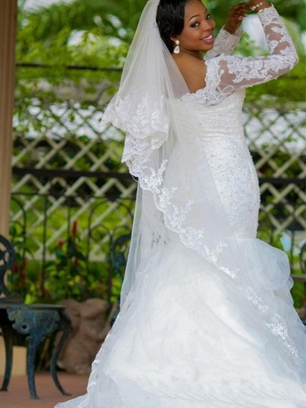 Abiti da sposa a sirena/tromba con maniche lunghe e strascico a cappella in organza con applicazioni quadrate