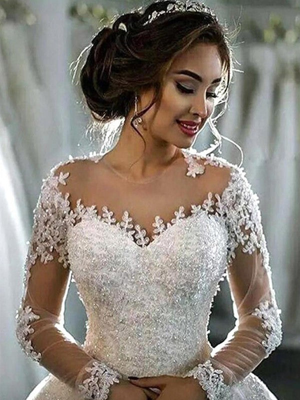 Vestido de novia con apliques de tul, escote redondo, mangas largas y cola de corte