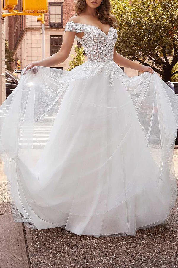 Off the shoulder lace decal with a simple white wedding dress paired with a detachable hem for the bride's dress