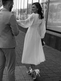 Ivory Satin A-Line Tea-Length Bridesmaid Dress with High Neck and Voluminous Puff Sleeves