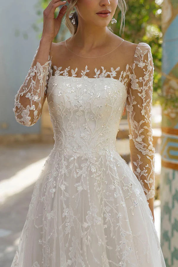 Vestido de novia de encaje con mangas largas y escote ilusión
