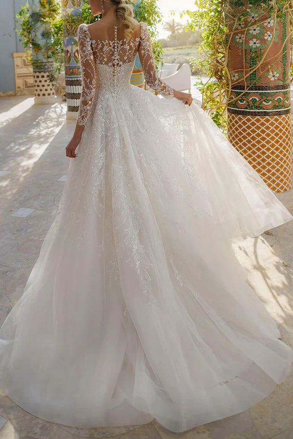 Vestido de novia de encaje con mangas largas y escote ilusión