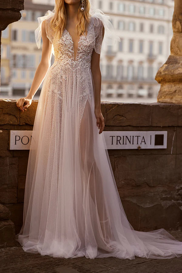 Vestido de novia bohemio brillante con apliques de encaje y escote en V profundo en forma de A