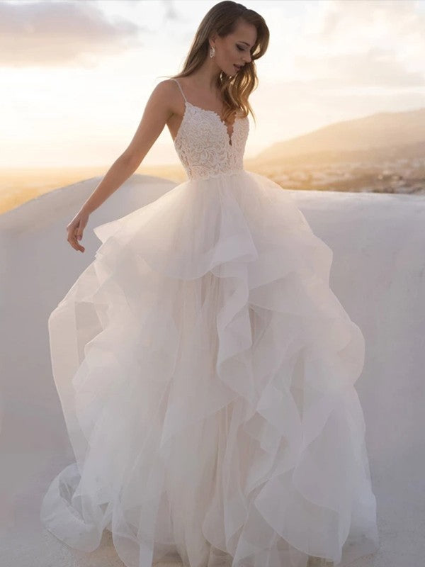 Vestido de novia de corte princesa, con escote en V, encaje transparente, tirantes finos, sin mangas y cola de cepillo.